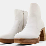 White and wood boot