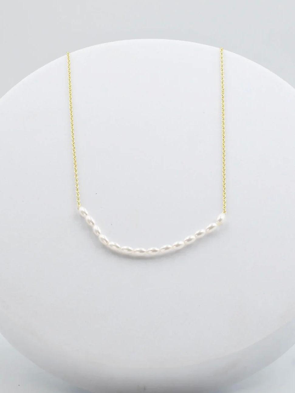 Gold and Pearl necklace 
Simple gold necklace 
