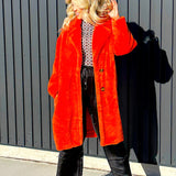 Steve Madden faux fur jacket, fully lined two buttons and bright red/oragne in color