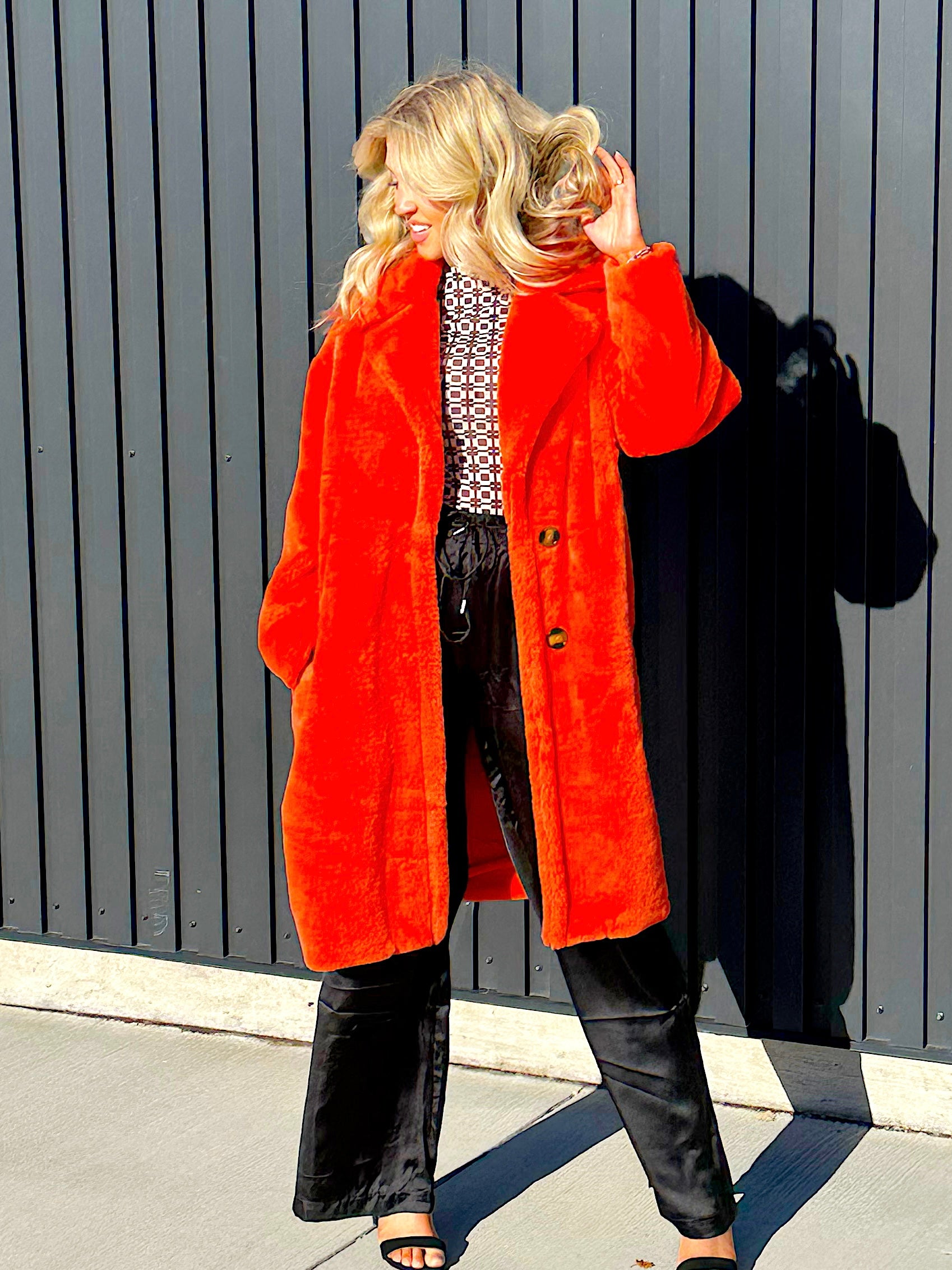 Steve Madden faux fur jacket, fully lined two buttons and bright red/oragne in color