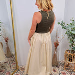 Olive sleeveless bodice contrast midi dress with cream flowing skirt, shown from back view.