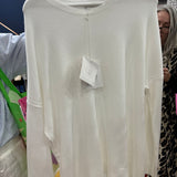 Cream white oversized sweater with drop shoulders and ribbed details on display