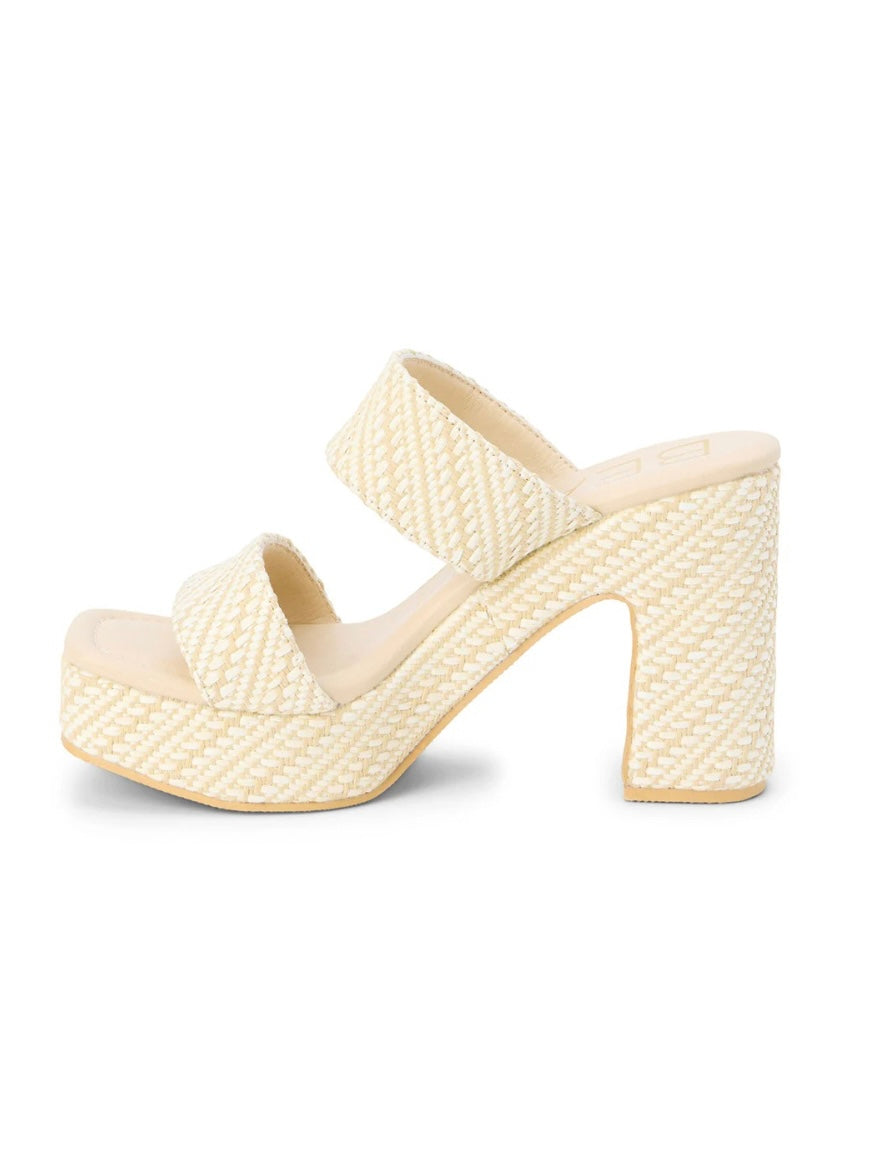 Cream woven raffia platform mule sandal with double straps and chunky block heel.