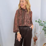 Brown and mauve floral print chiffon blouse with pussy bow neck tie, styled with dark chocolate faux leather wide-leg trouser