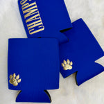Royal blue neoprene koozies with gold paw print and CHAMPS lettering on white fur background