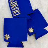 Royal blue neoprene koozies with gold paw print and CHAMPS lettering on white fur background