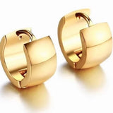Pair of small gold huggie hoop earrings with polished finish and hinged closure
