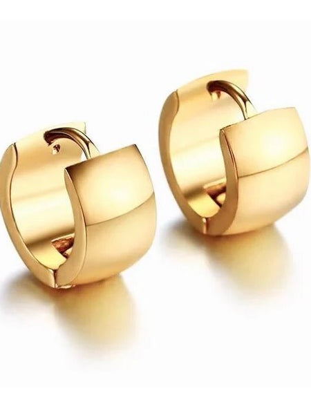 Pair of small gold huggie hoop earrings with polished finish and hinged closure