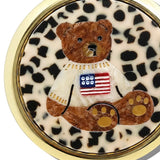 Round gold compact mirror featuring a leopard print background with a brown teddy bear wearing an American flag sweater.