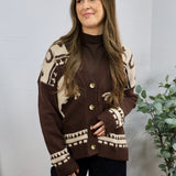 Brown and cream western-patterned knit cardigan with gold buttons, layered over brown turtleneck.