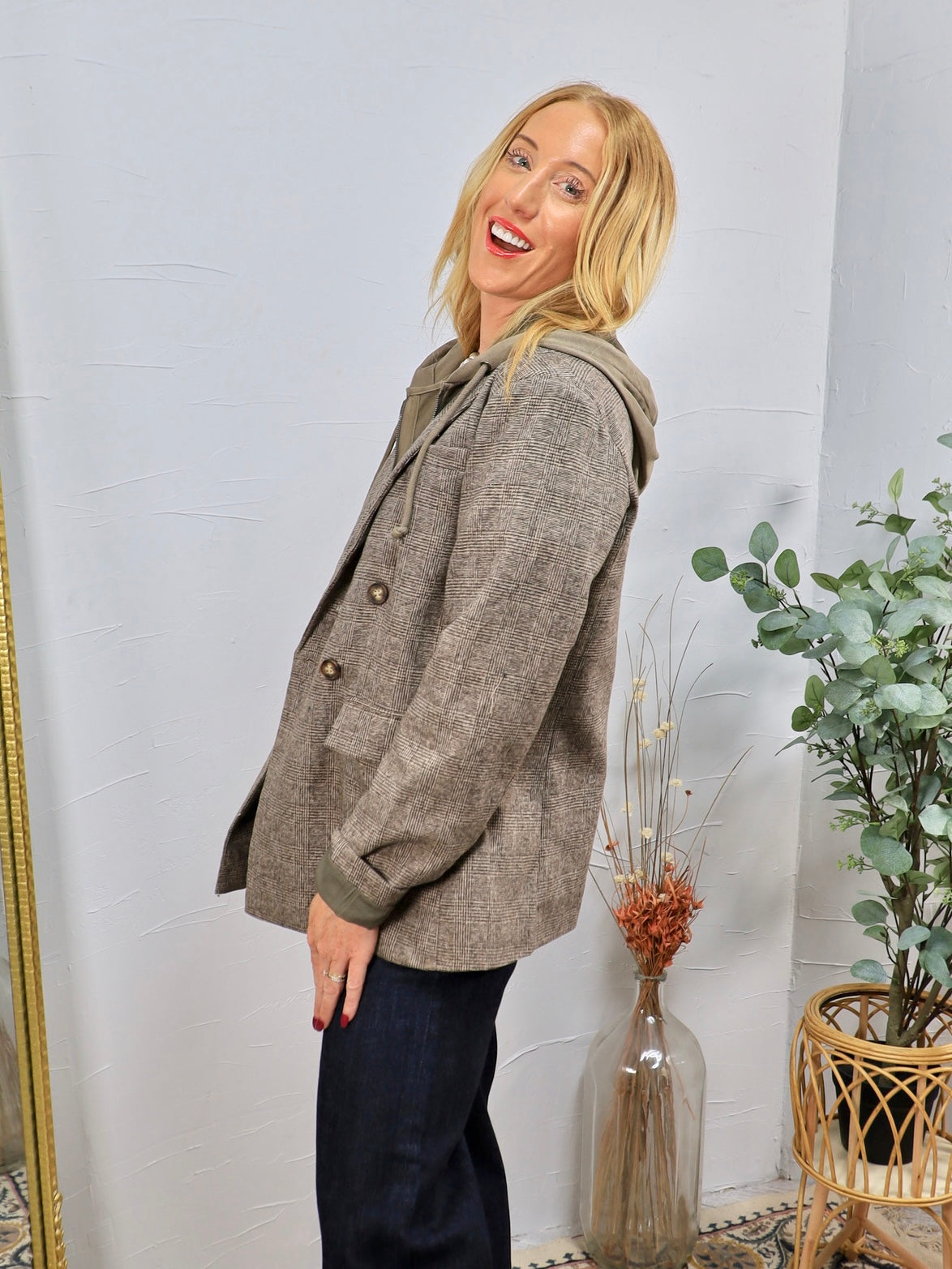 Collins Hooded Blazer in brown plaid, styled over olive hoodie with dark jeans, featuring gold buttons.