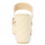 Cream woven raffia block heel sandal with double straps, shown from back view.