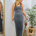 Woman wearing grey fitted ribbed maxi dress with tank top style and scoop neckline