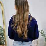 Navy blue contrast collar cardigan styled with light wash jeans, shown from the back view.