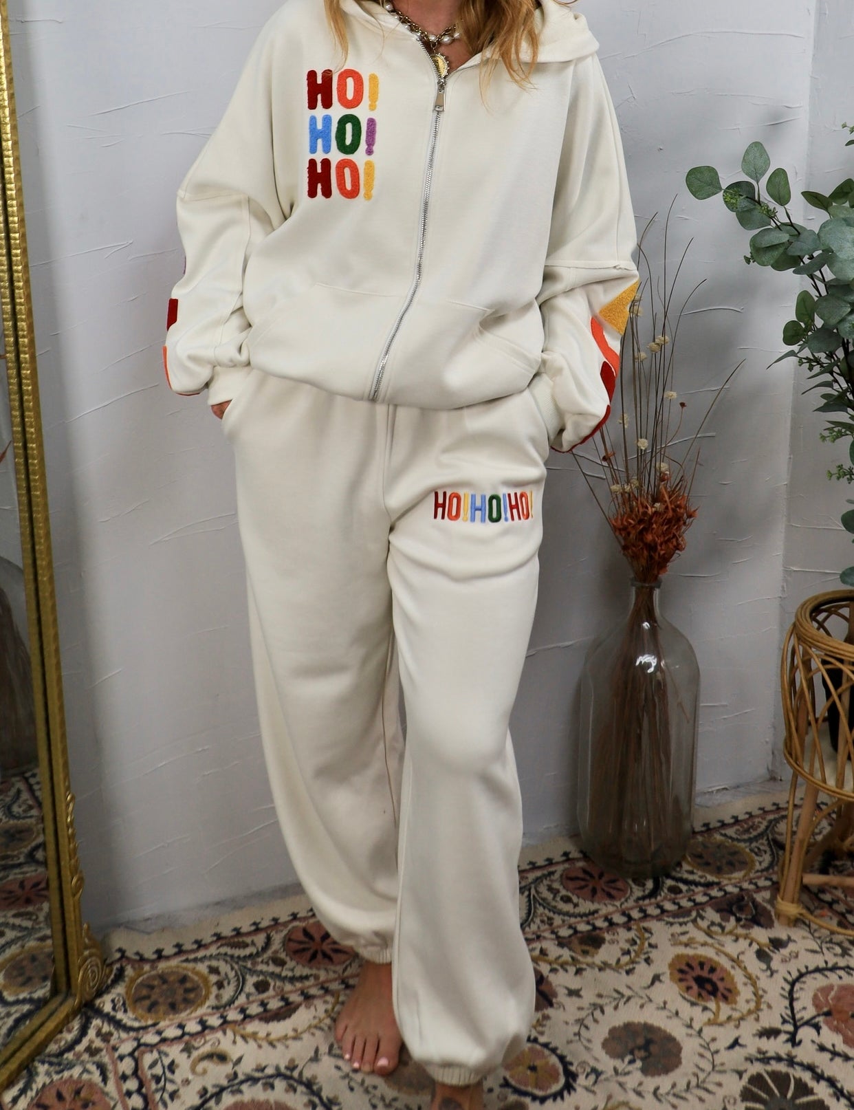 Cream oversized joggers with rainbow embroidered HO HO HO holiday lettering on thigh