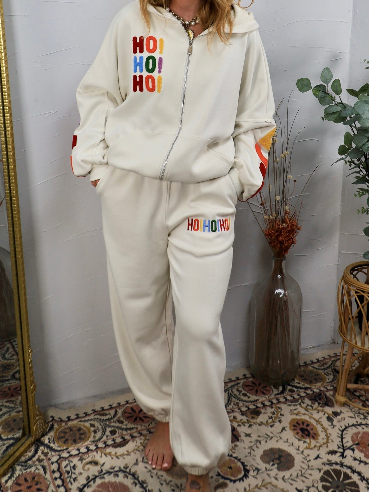 Cream oversized joggers with rainbow embroidered HO HO HO holiday lettering on thigh