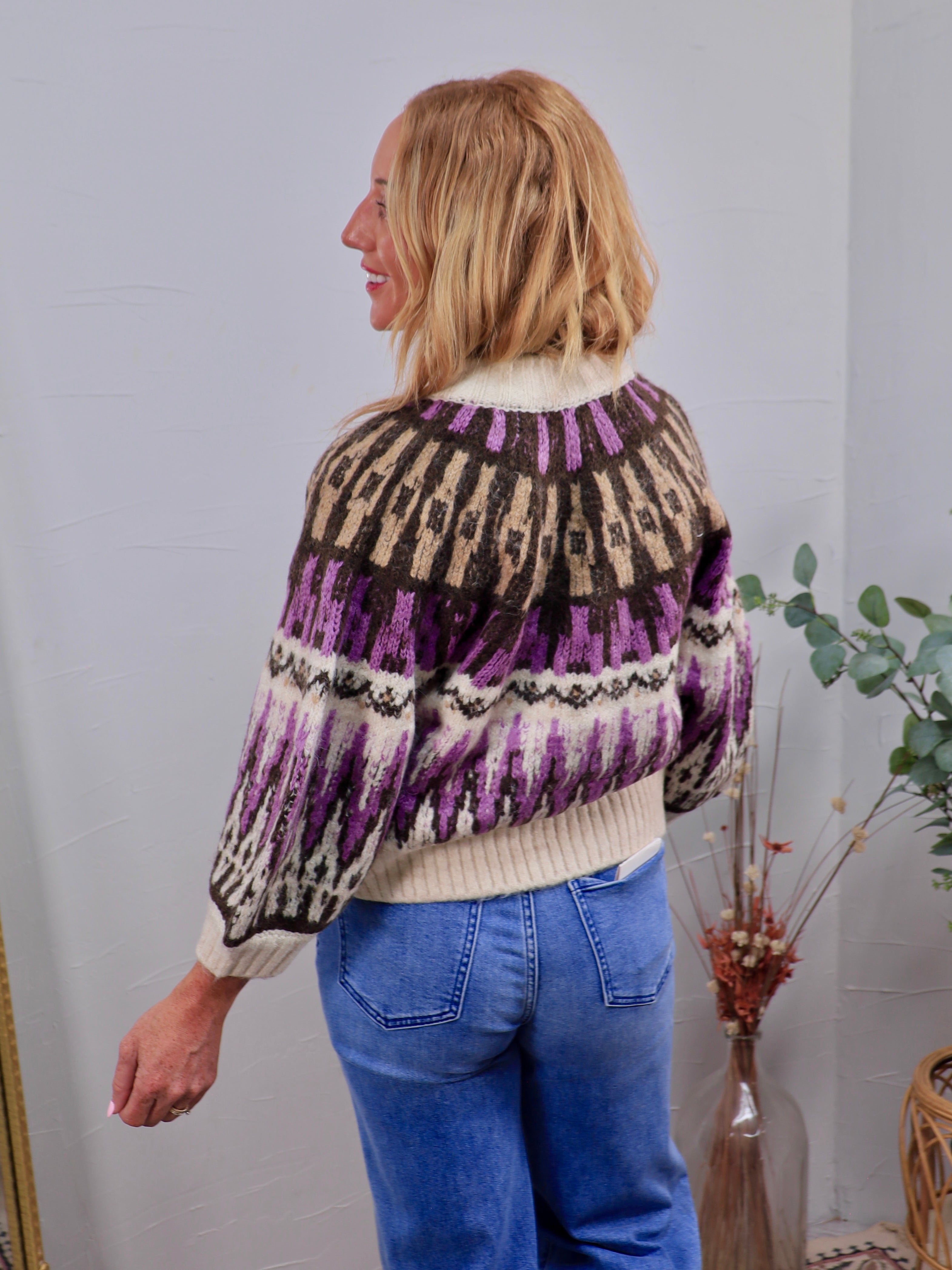 Adley Sweater in purple, brown, and cream Fair Isle pattern, styled with blue jeans, back view shown.