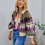 Woman wearing cropped purple and cream Fair Isle zip-up sweater with balloon sleeves and blue jeans
