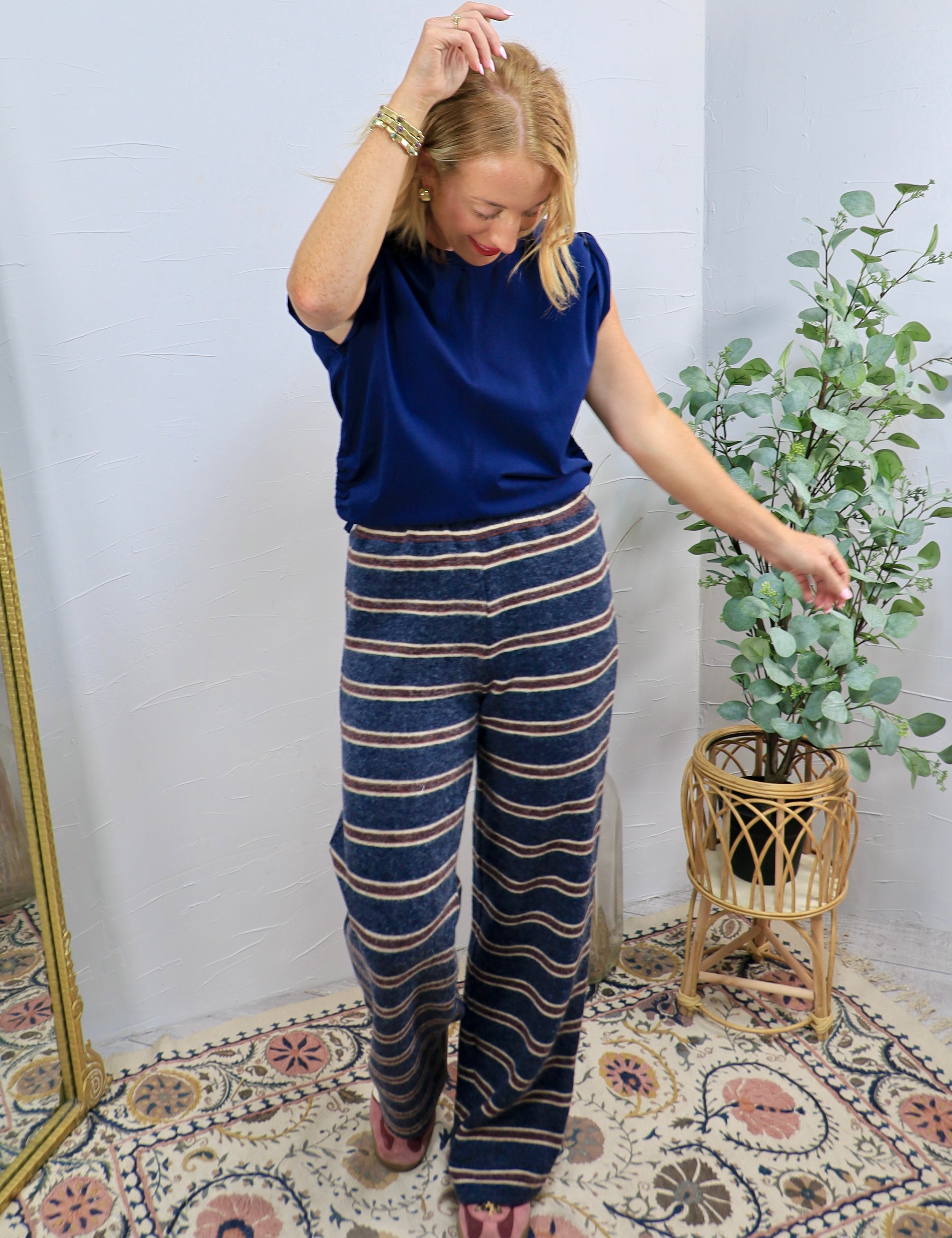 Navy blue striped wide-leg lounge pants styled with a matching cobalt blue short-sleeve top.