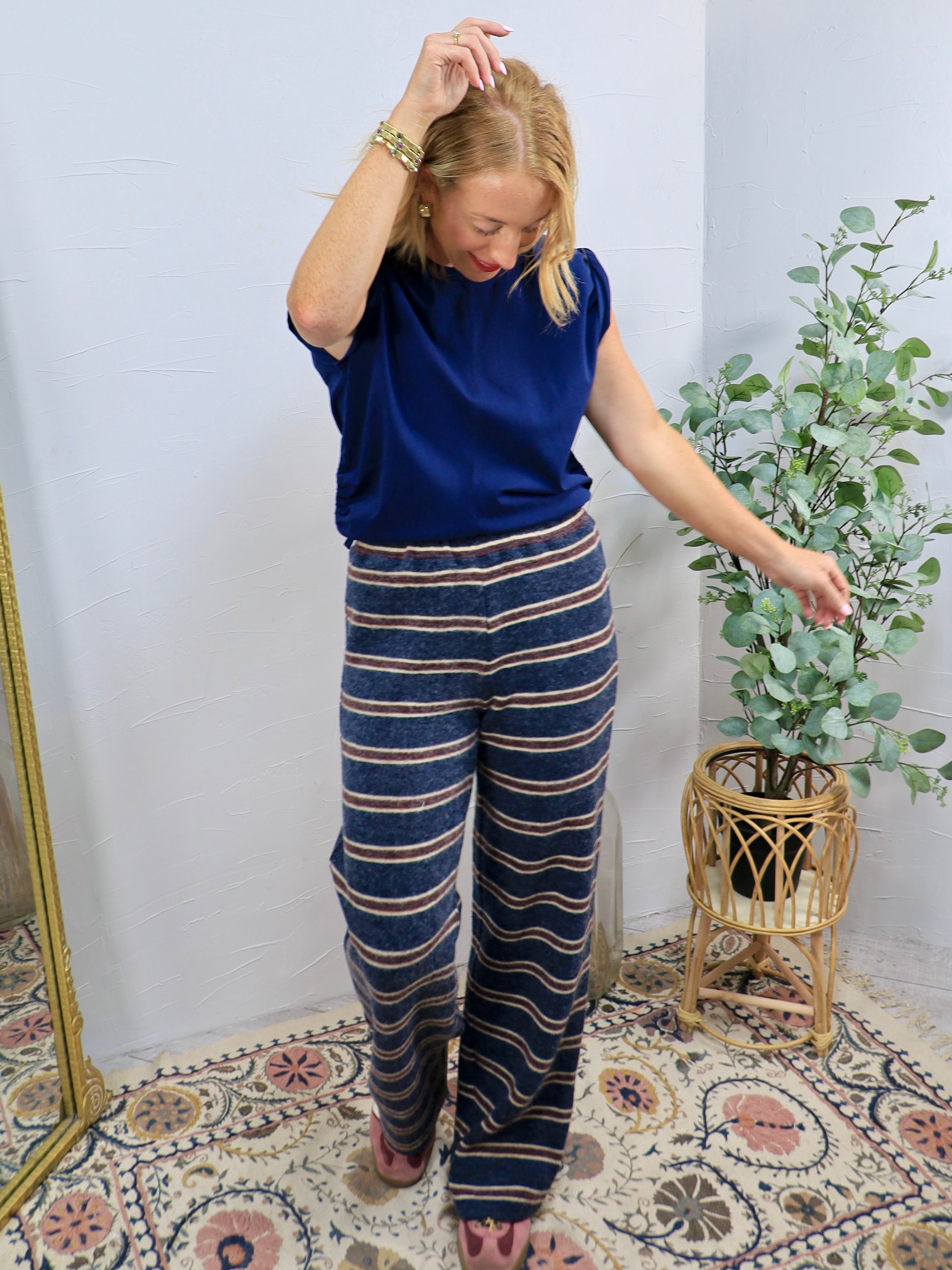 Navy blue striped wide-leg lounge pants styled with a matching cobalt blue short-sleeve top.