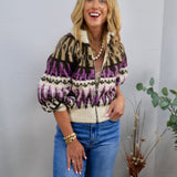Cream, purple, and black Fair Isle zip-up sweater with puff sleeves, styled with blue jeans and gold jewelry.