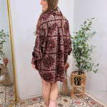 Burgundy paisley patterned oversized long sleeve shirt dress styled with blush pink cowboy boots.