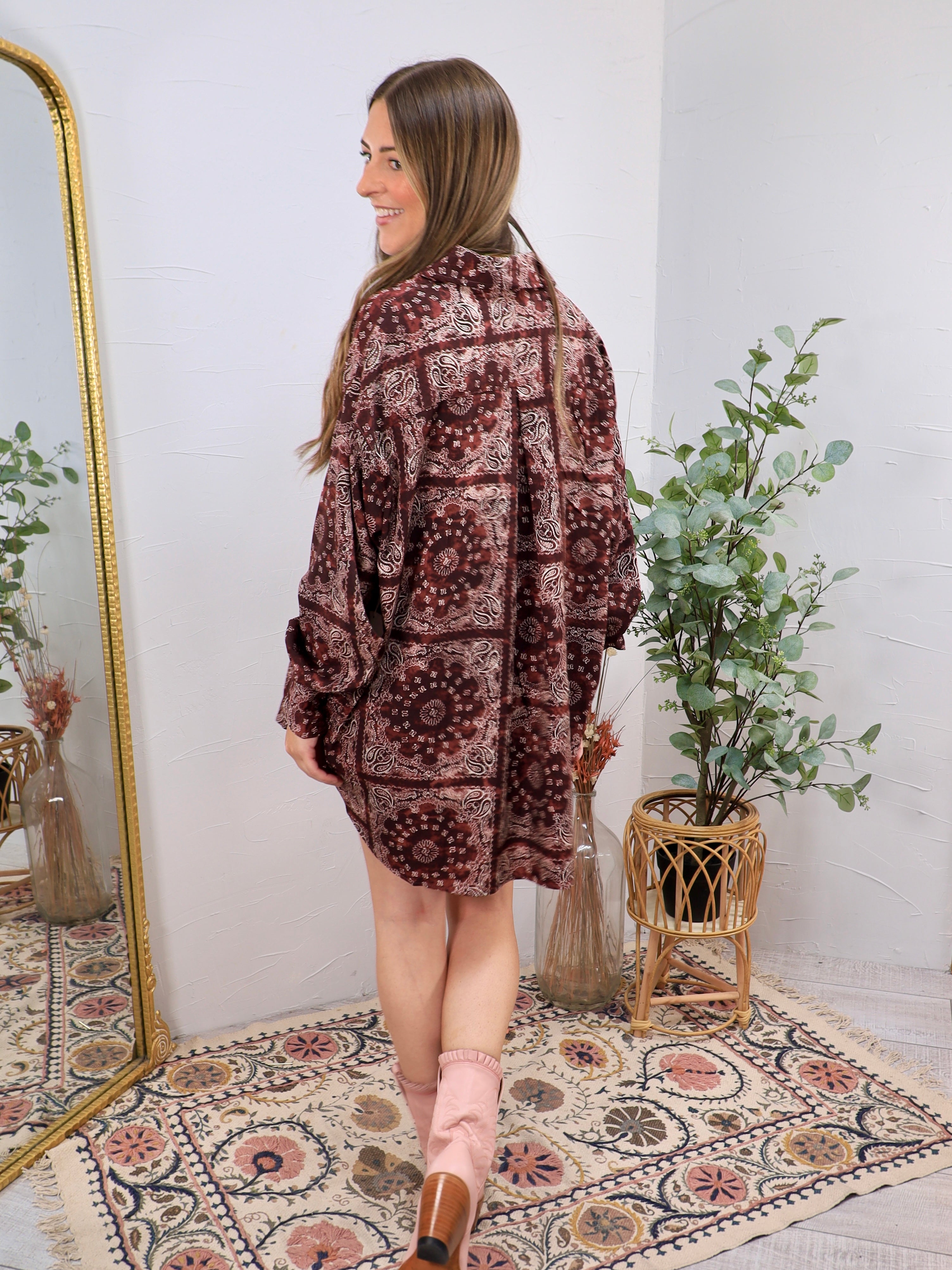 Burgundy paisley patterned oversized long sleeve shirt dress styled with blush pink cowboy boots.