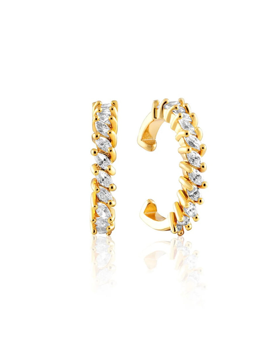 Gold tone ear cuffs with sparkling baguette crystals arranged in jagged pattern