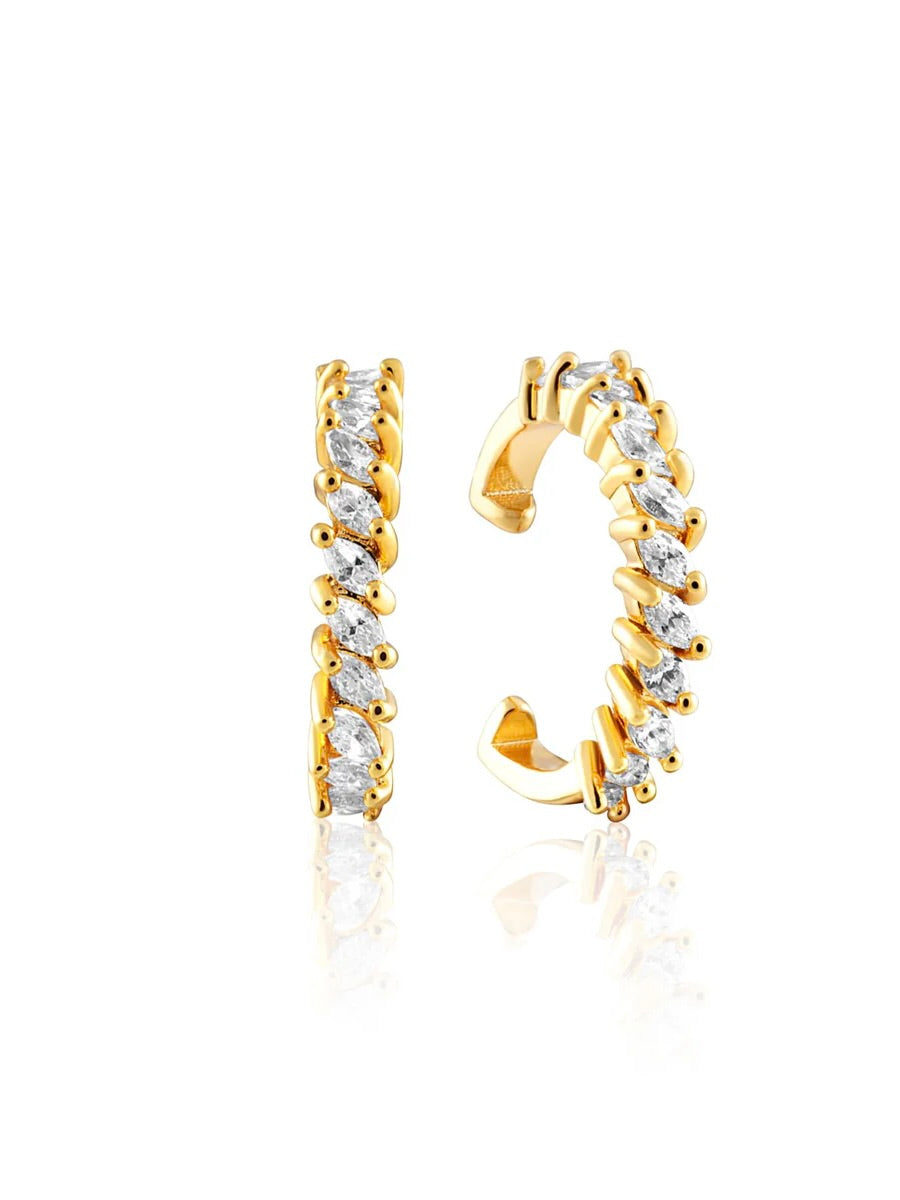 Gold tone ear cuffs with sparkling baguette crystals arranged in jagged pattern