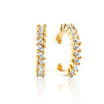 Gold tone ear cuffs with sparkling baguette crystals arranged in jagged pattern