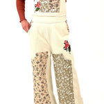 cream overalls with patchwork detail throughout