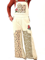 cream overalls with patchwork detail throughout
