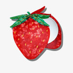 Strawberry-shaped compact mirror in red marbled acrylic with green leaf hinge, yellow seed details, open revealing round mirr