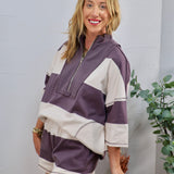 Purple and cream wide-stripe half-zip pullover top with matching shorts set, styled casually.