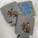 Gray foam koozies with wildcat riding bear illustration and blue Go Cats Go text on fur background