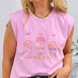 Woman wearing pink sleeveless muscle tee with three cowboy figures and "montana" text, styled with jeans and gold chain neckl