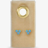 Gold-tone turquoise three-stone cluster stud earrings displayed on a beige velvet card