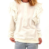 white sweater with ruffle detail