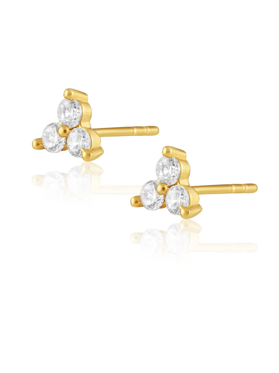 Gold stud earrings with three round clear crystals arranged in triangular cluster formation on white background.