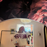 White crewneck sweatshirt with red sequin "MERRY" lettering, red striped trim, styled with dark jeans, mirror selfie.