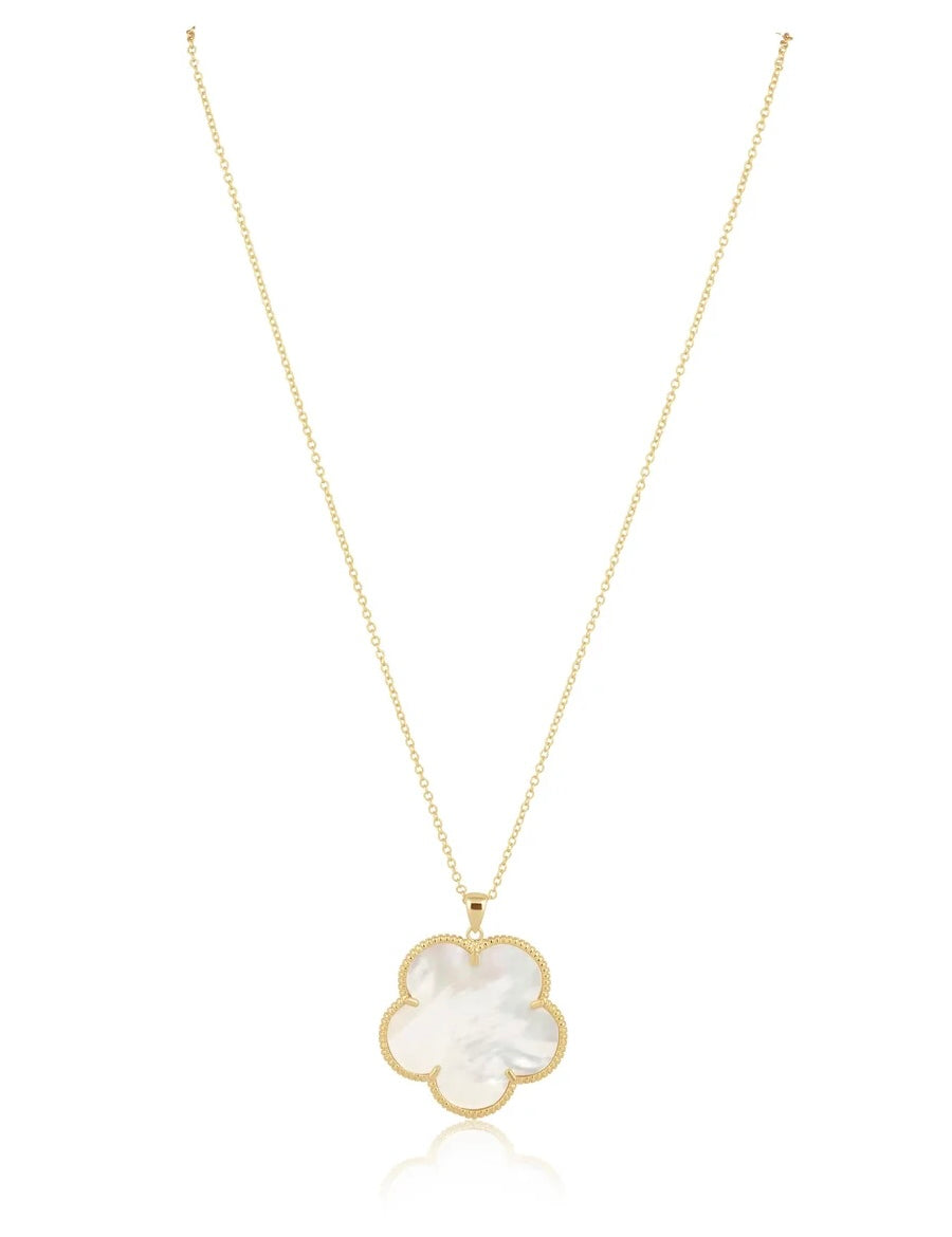 Gold chain necklace featuring a large mother-of-pearl four-leaf clover pendant with milgrain gold border.