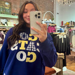 Navy blue "Go Cats Go" graphic crewneck sweatshirt with patchwork gingham and floral appliqué lettering in gold and white.