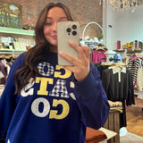 Navy blue "Go Cats Go" graphic crewneck sweatshirt with patchwork gingham and floral appliqué lettering in gold and white.