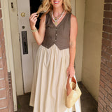 Woman wearing olive contrast vest midi dress with cream skirt, woven bag, and oversized sunglasses