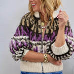 Adley Sweater in purple, brown, and cream Fair Isle knit pattern with zip front, worn with jeans.