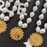Pearl beaded necklaces with gold crystal-halo coin pendants engraved with Love Each Other More