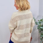 Cream and taupe striped fuzzy crewneck sweater with dolman sleeves, styled with blue velvet pants.