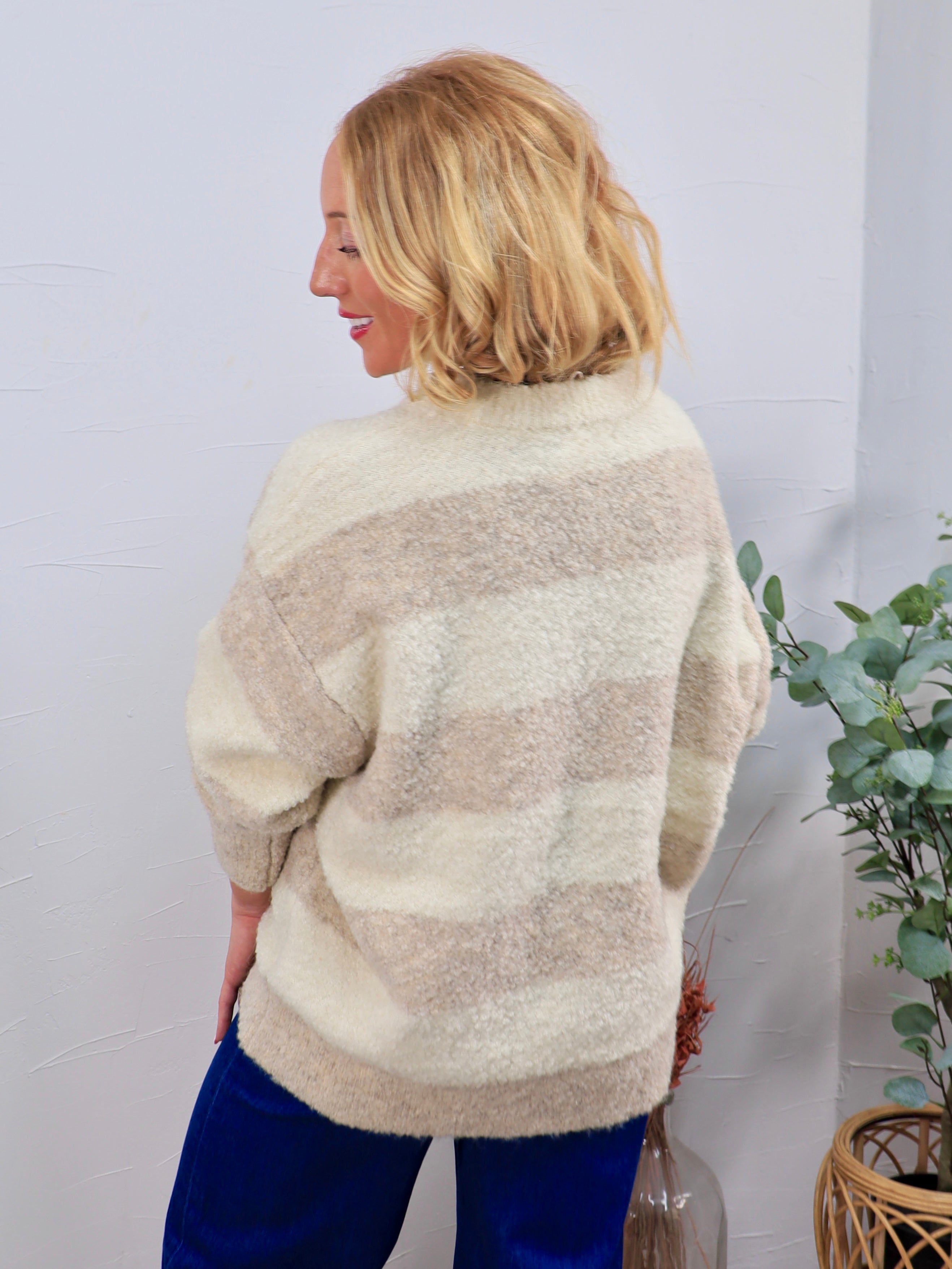 Cream and taupe striped fuzzy crewneck sweater with dolman sleeves, styled with blue velvet pants.