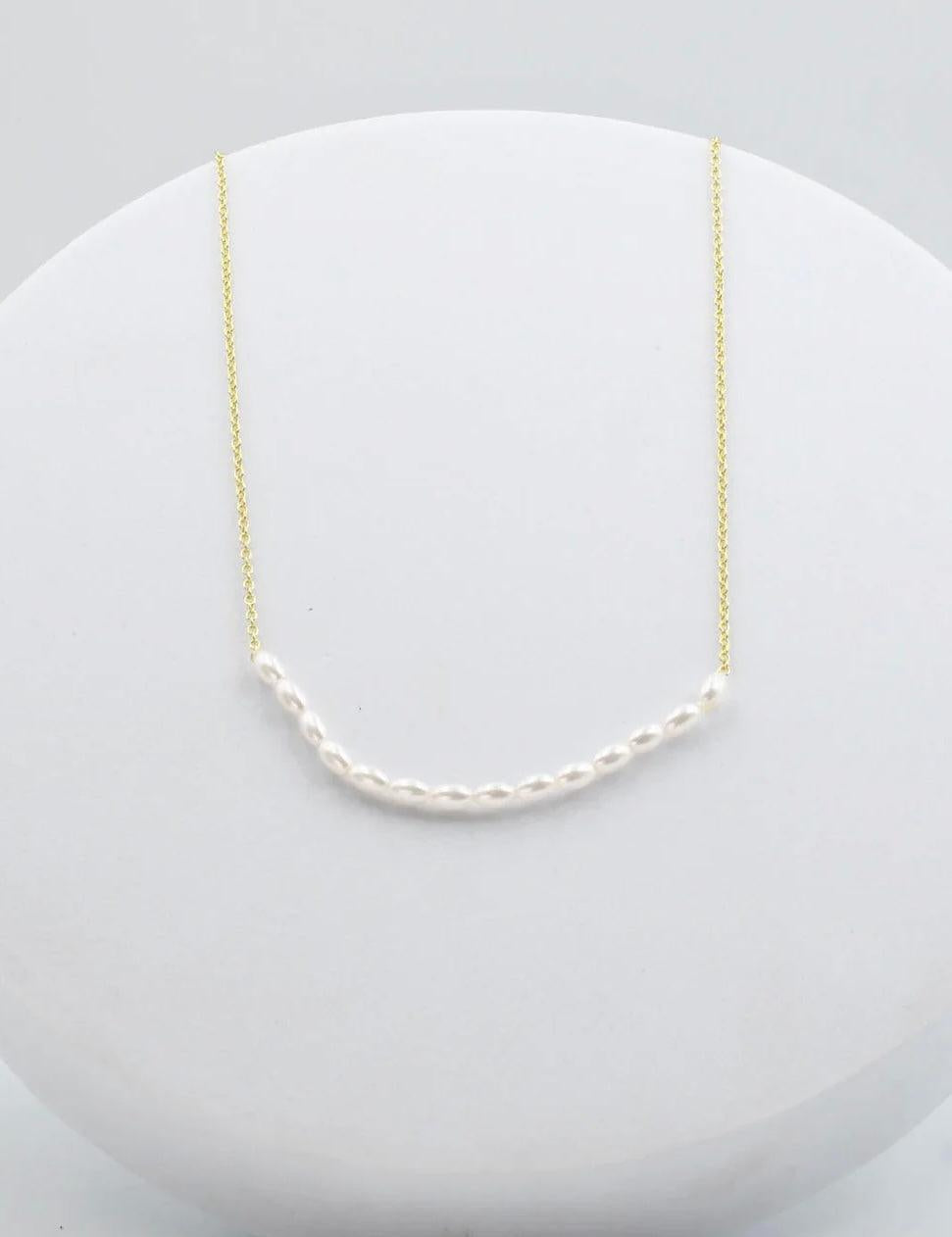 Gold and Pearl necklace 
Simple gold necklace 
