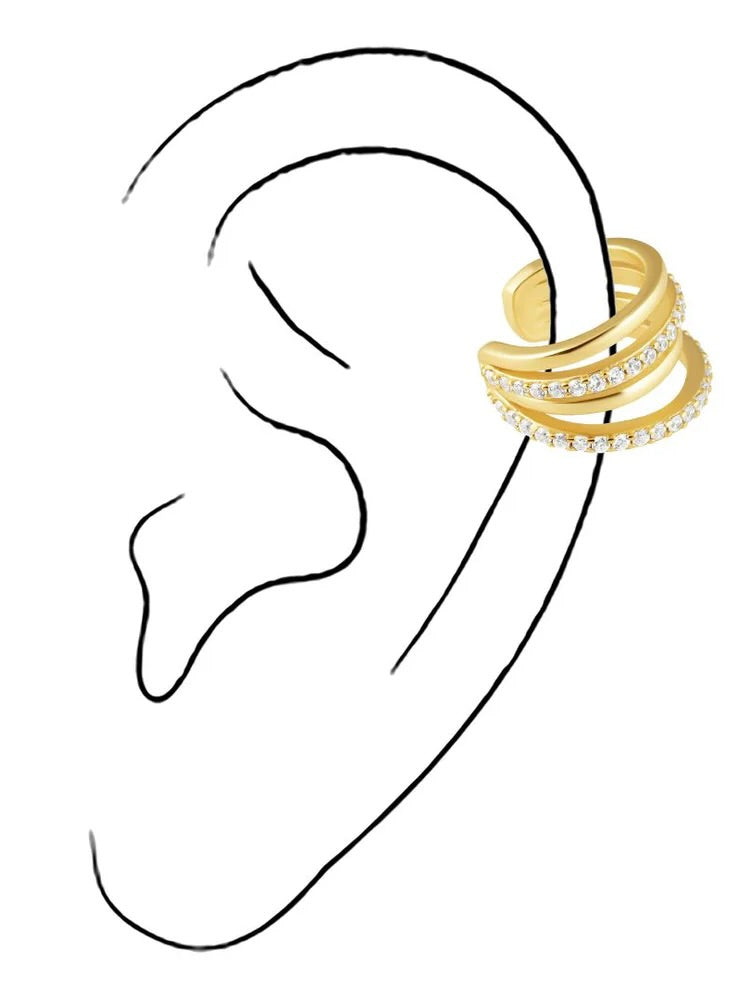 Gold tone triple band ear cuff with crystal details worn on illustrated ear